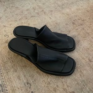 By far black mules with heel